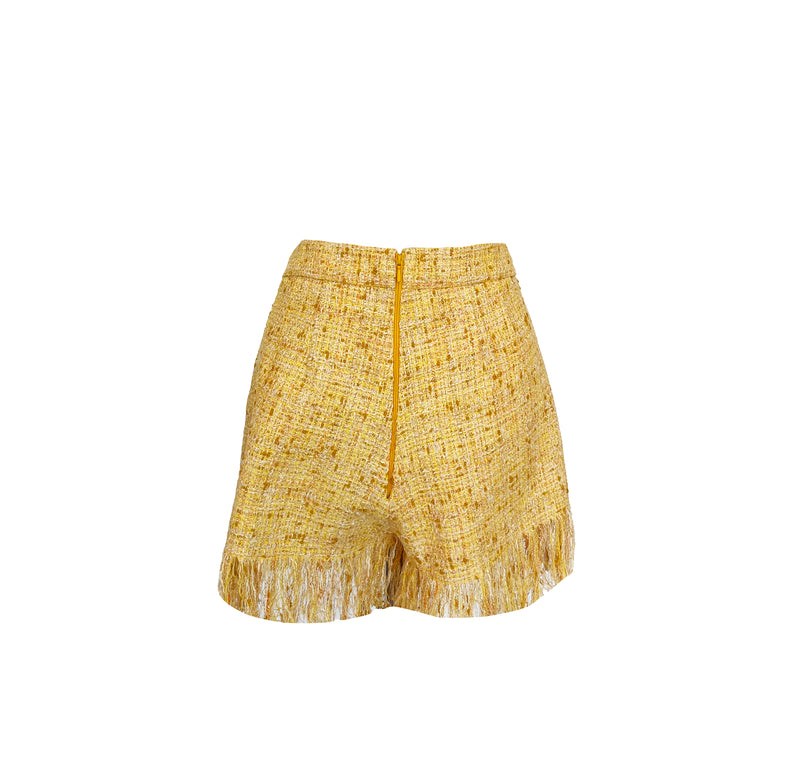 Shorts i gul stoff med frynser